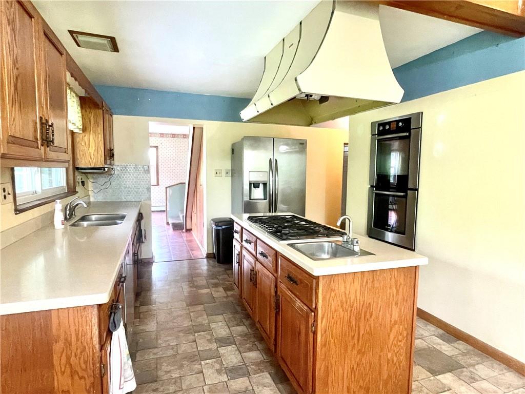 472 West Sunbury Road Butler, PA 16001 - Photo 10 of 39 a kitchen with stainless steel appliances granite countertop a sink and a refrigerator