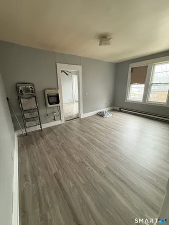 a view of a livingroom with wooden floor