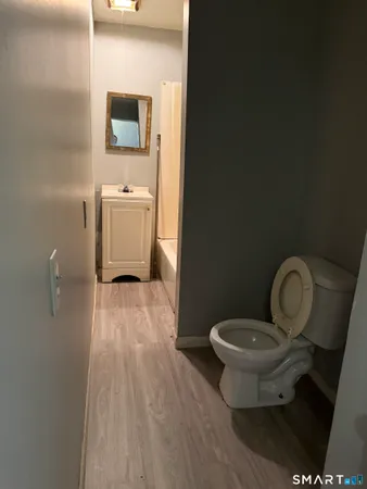a bathroom with a toilet and a sink