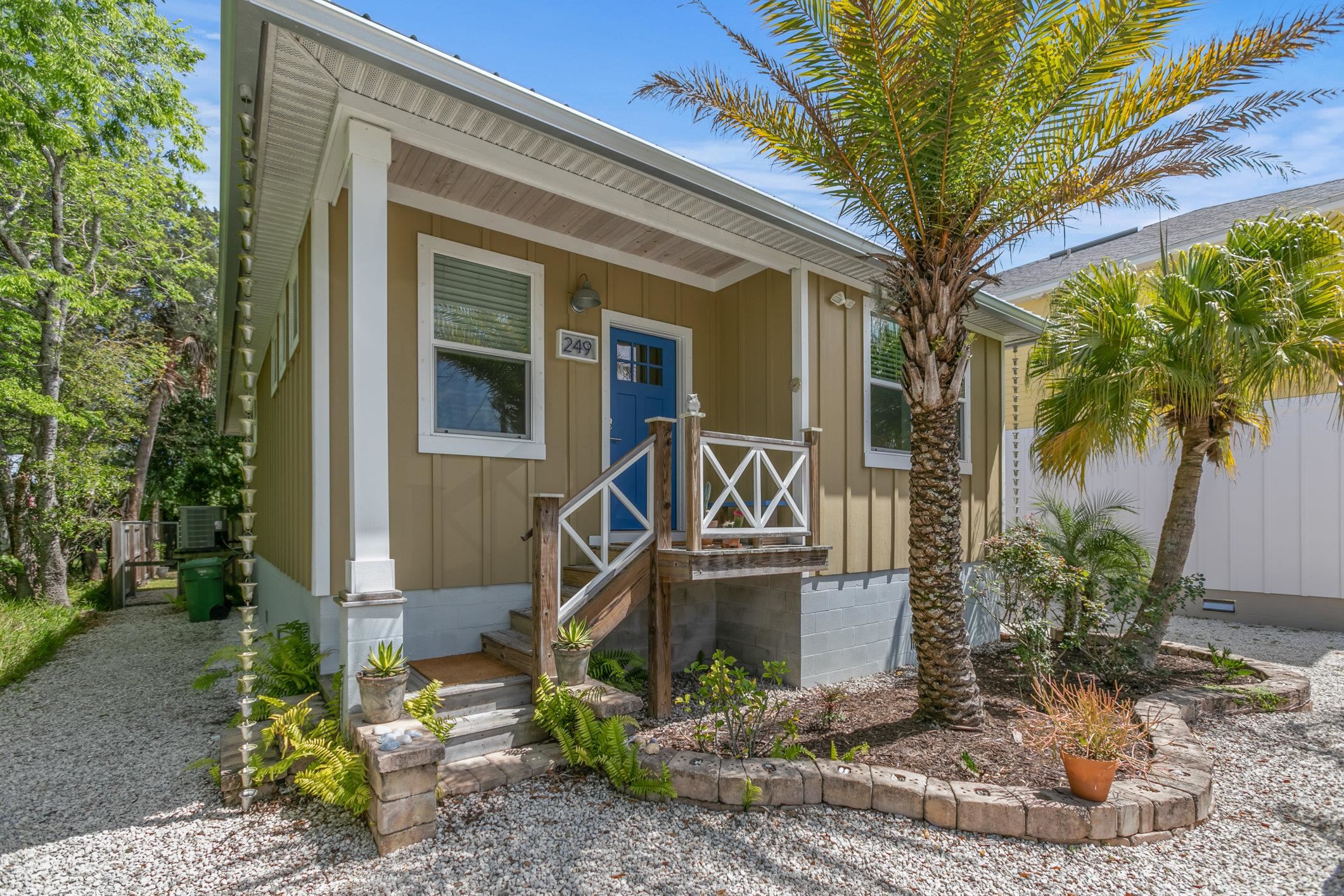 a front view of a house with garden