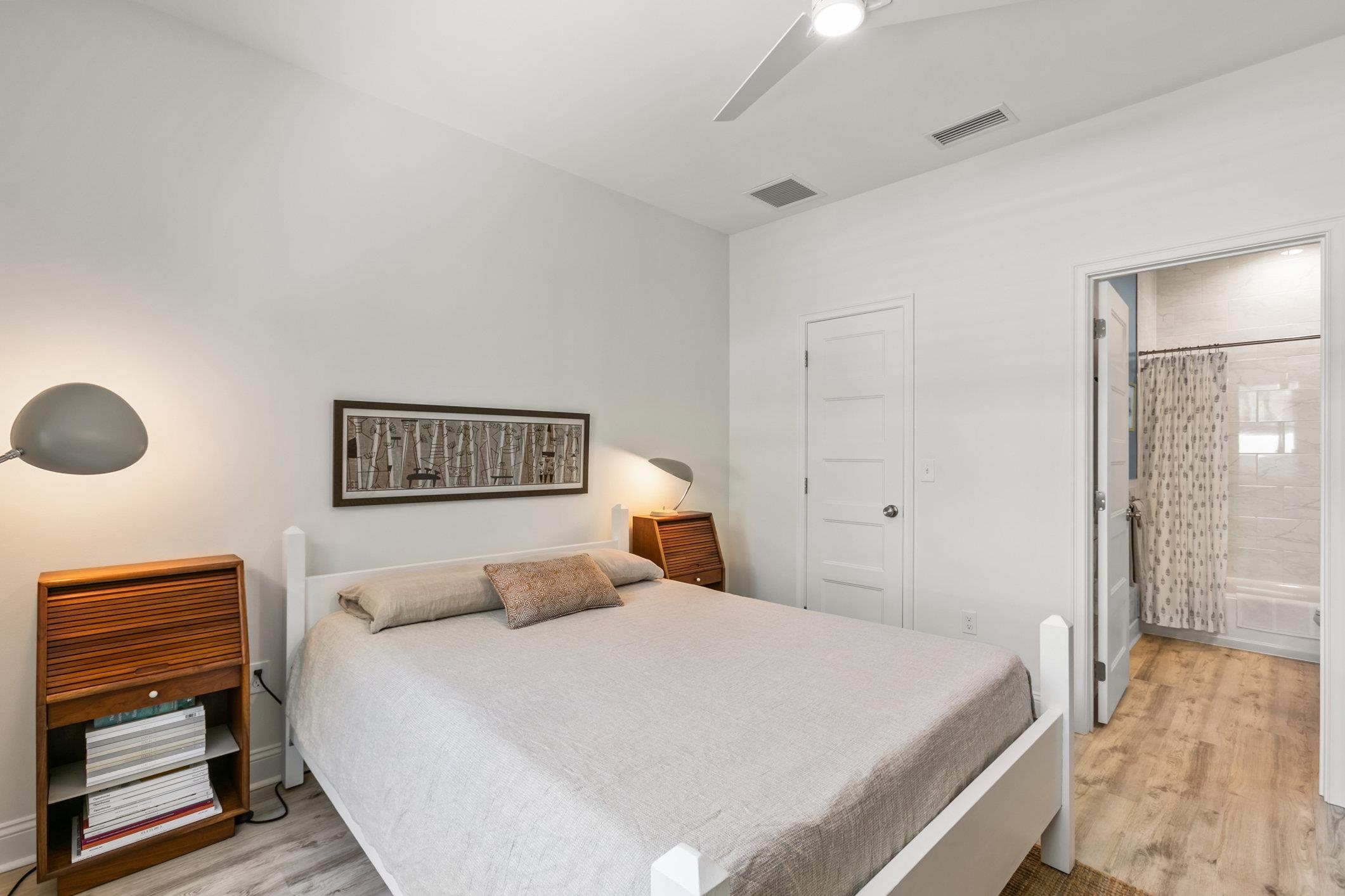 249 Riberia Street St. Augustine, FL 32084 - Photo 15 of 45 a bedroom with a bed and a lamp