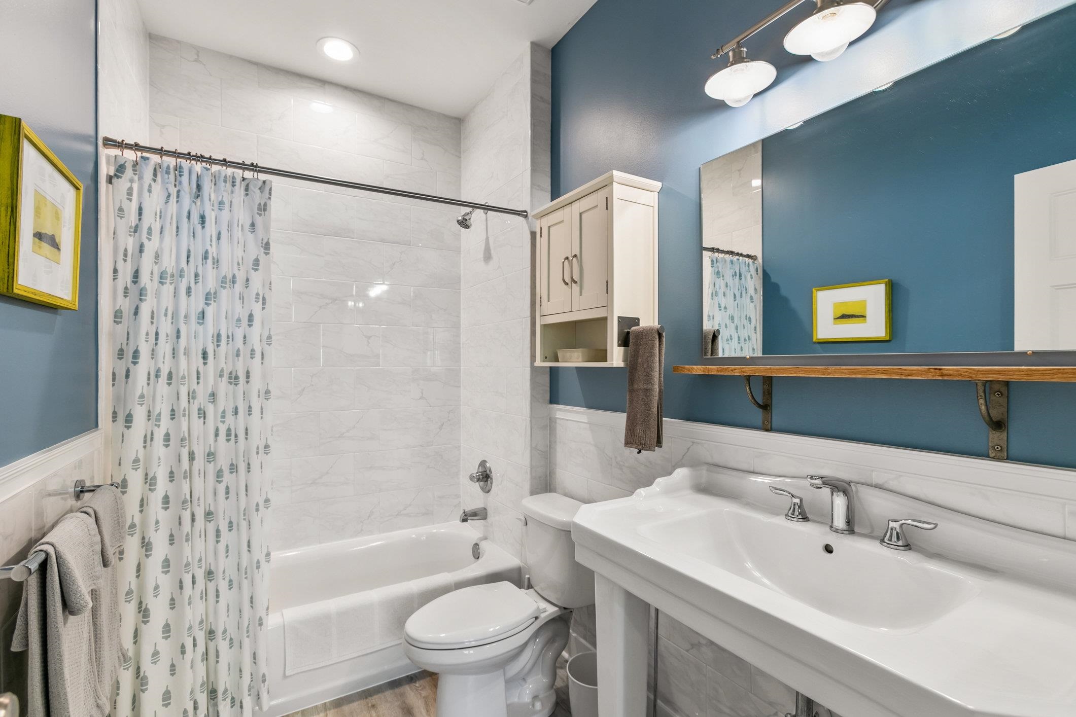 249 Riberia Street St. Augustine, FL 32084 - Photo 18 of 45 a bathroom with a bathtub shower sink vanity mirror and toilet