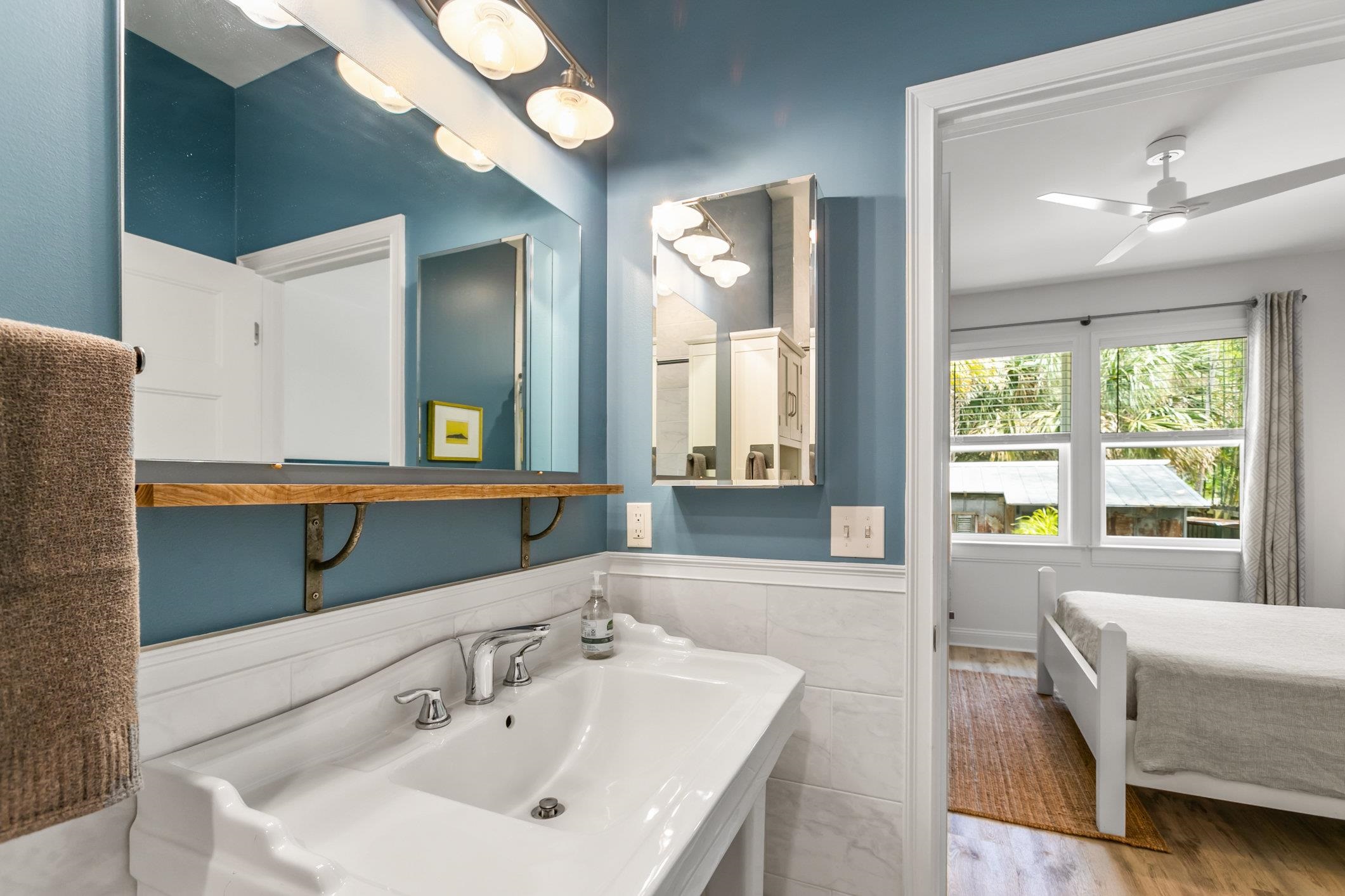 249 Riberia Street St. Augustine, FL 32084 - Photo 19 of 45 a bathroom with a sink and a mirror