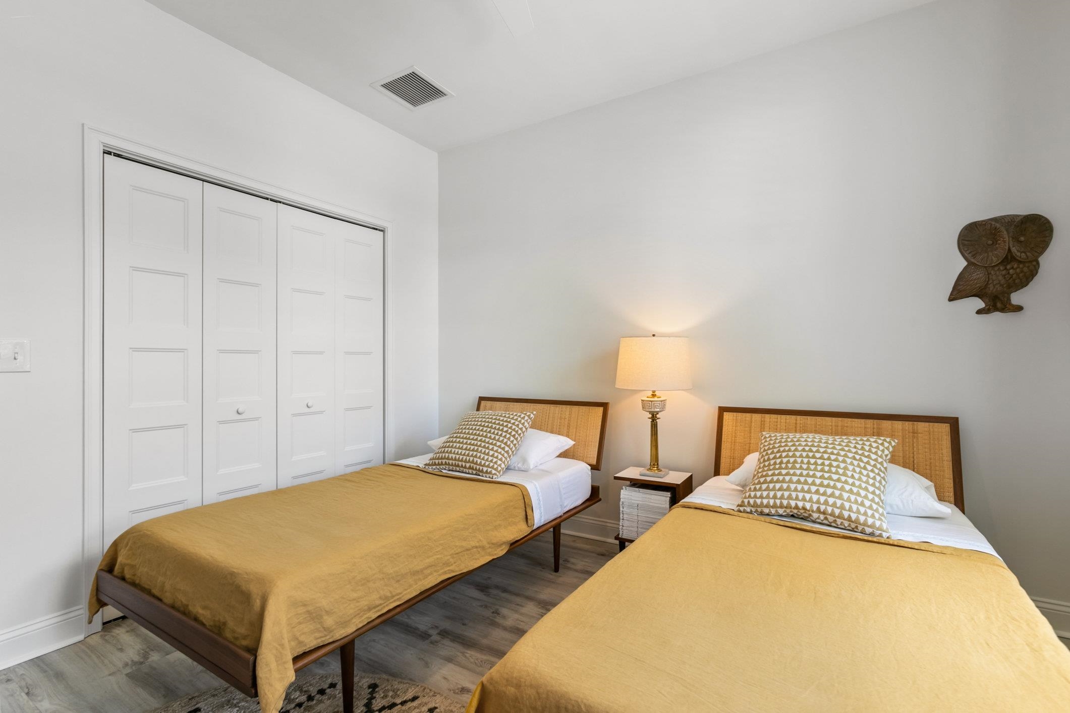 249 Riberia Street St. Augustine, FL 32084 - Photo 21 of 45 a bedroom with two beds and painting on the wall