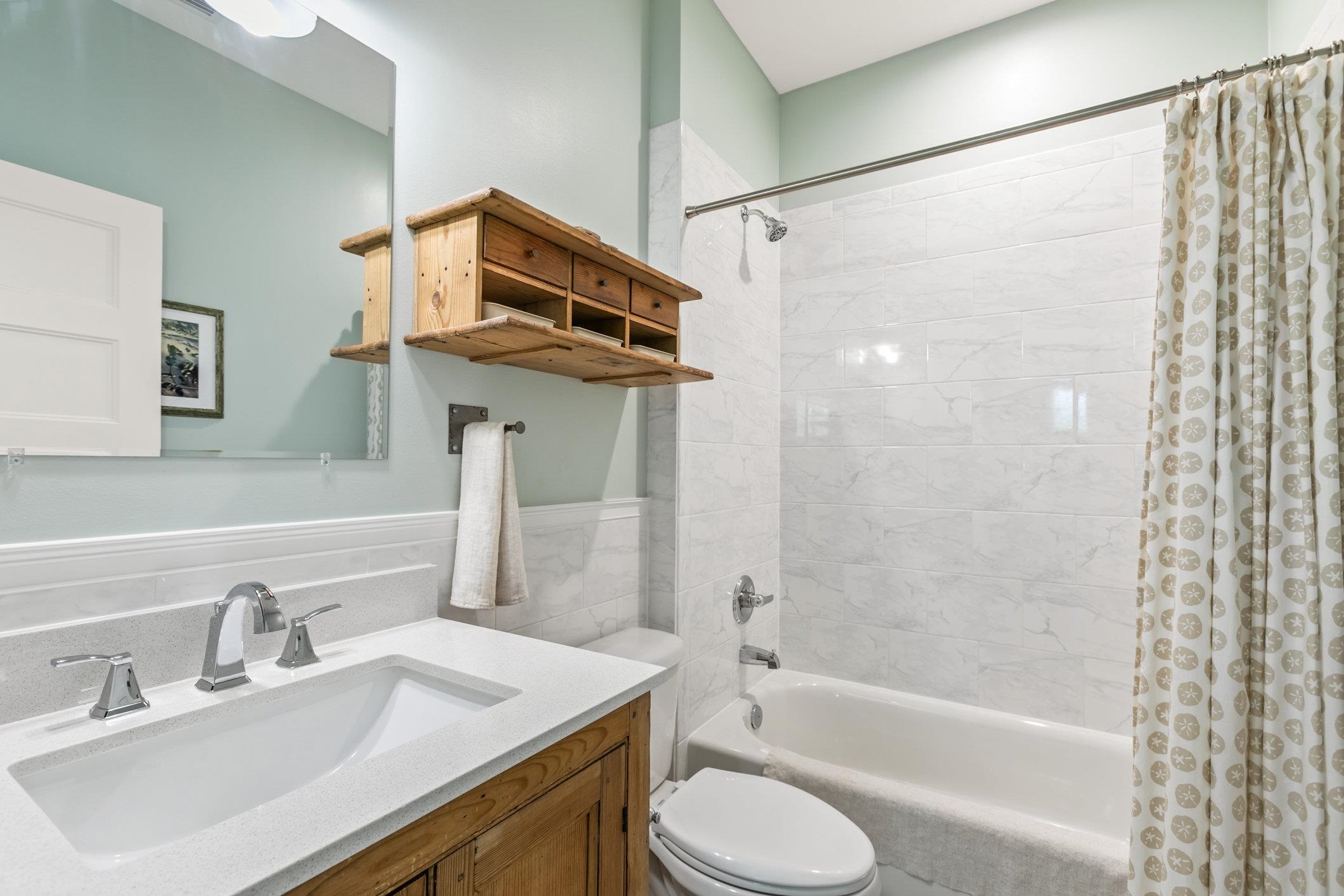 249 Riberia Street St. Augustine, FL 32084 - Photo 24 of 45 a bathroom with a sink toilet tub and shower