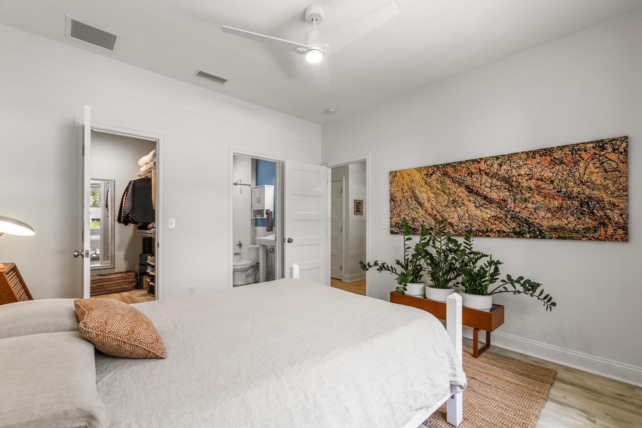 249 Riberia Street St. Augustine, FL 32084 - Photo 26 of 45 a bedroom with a bed and painting on the wall