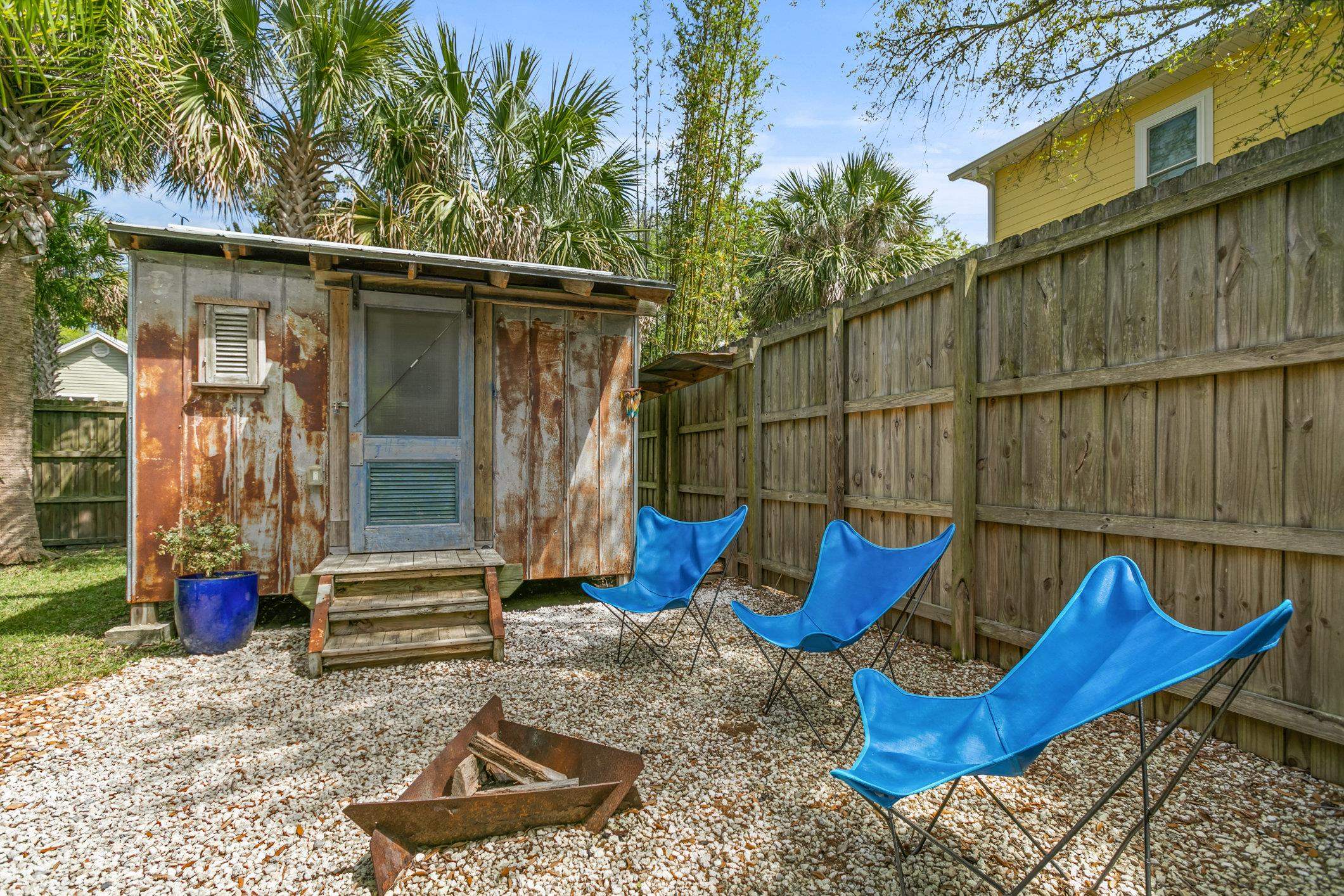 249 Riberia Street St. Augustine, FL 32084 - Photo 33 of 45 a blue bench sitting in front of a building