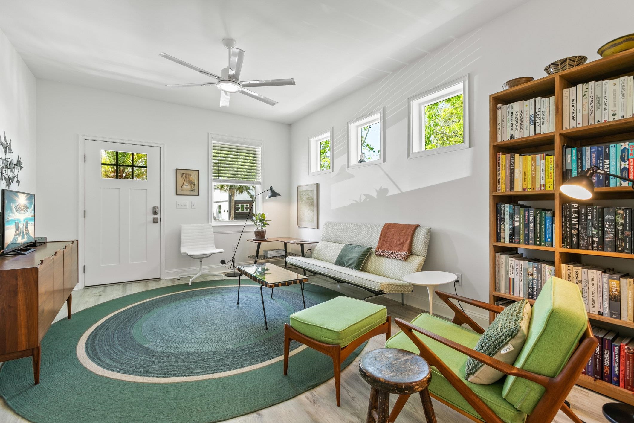 249 Riberia Street St. Augustine, FL 32084 - Photo 5 of 45 a living room with furniture a bookshelf and a window