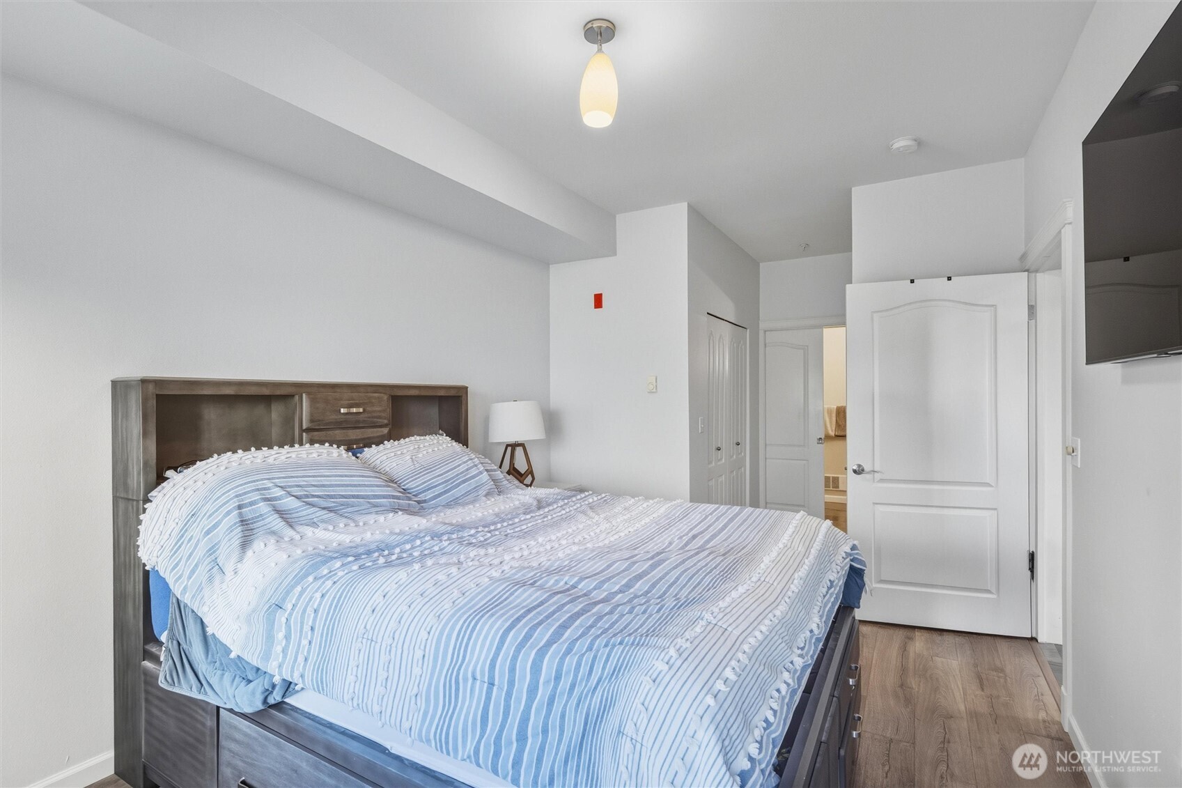 255 West Bakerview Road, Unit B103 Bellingham, WA 98226 - Photo 25 of 40 a bedroom with a bed and a walk in closet