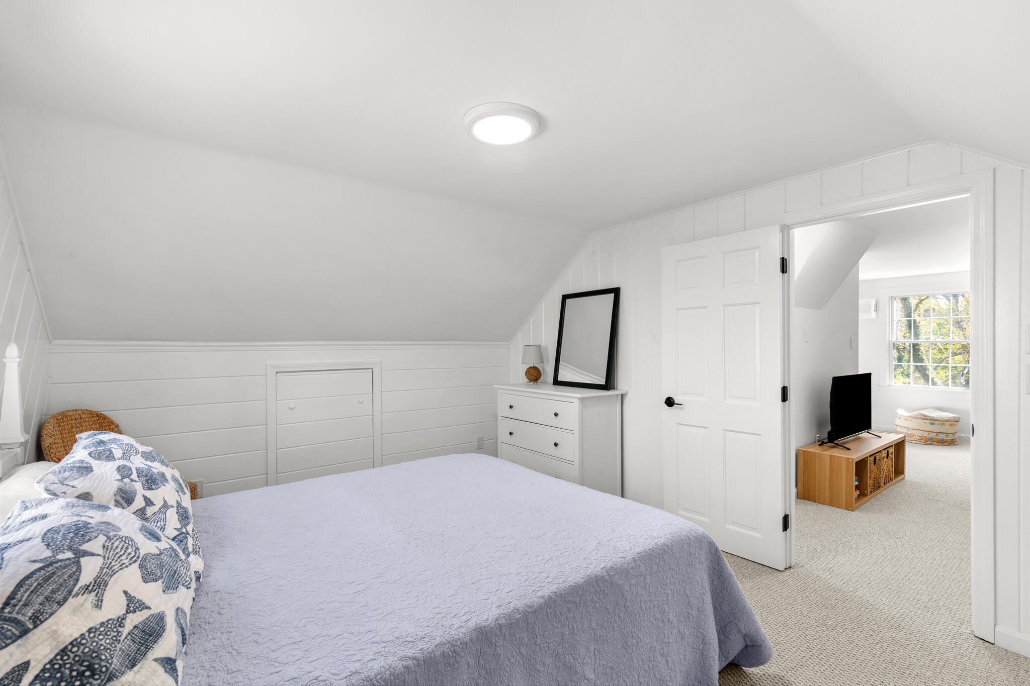 1295 Massasoit Road Eastham, MA 02642 - Photo 27 of 32 a bedroom with a bed and a large mirror