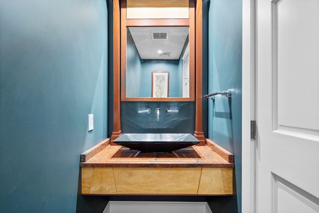 15 Forster Road Manchester, MA 01944 - Photo 13 of 42 a room with water heater and wooden door