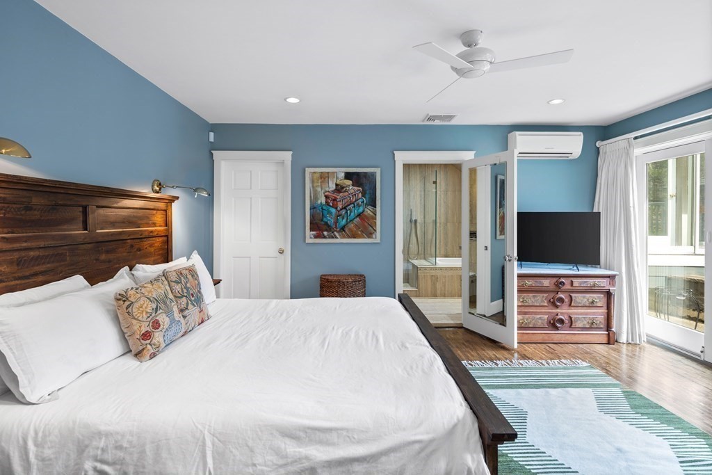 15 Forster Road Manchester, MA 01944 - Photo 25 of 42 a bedroom with a bed and a flat screen tv