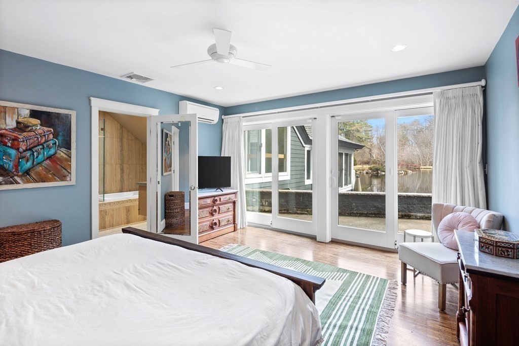 15 Forster Road Manchester, MA 01944 - Photo 26 of 42 a bedroom with a bed and a flat screen tv