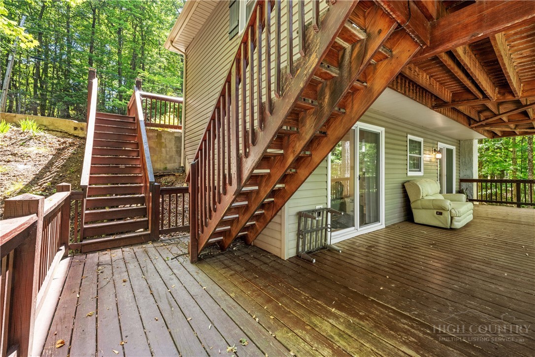 467 Horseshoe Ridge Road East Deep Gap, NC 28618 - Photo 23 of 46 a view of outdoor space with deck and furniture