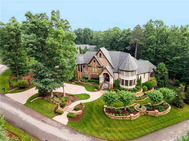 3016 Cone Manor Lane Raleigh, NC 27613 - Photo 2 of 25 Nubby 4 sided Freshly Painted Brick and Natural Builder Stone Exterior - - Barrel Vaulted Entry - Front facade enhanced by copper highlights - Front Door with iron overlay and Flemish glass.
