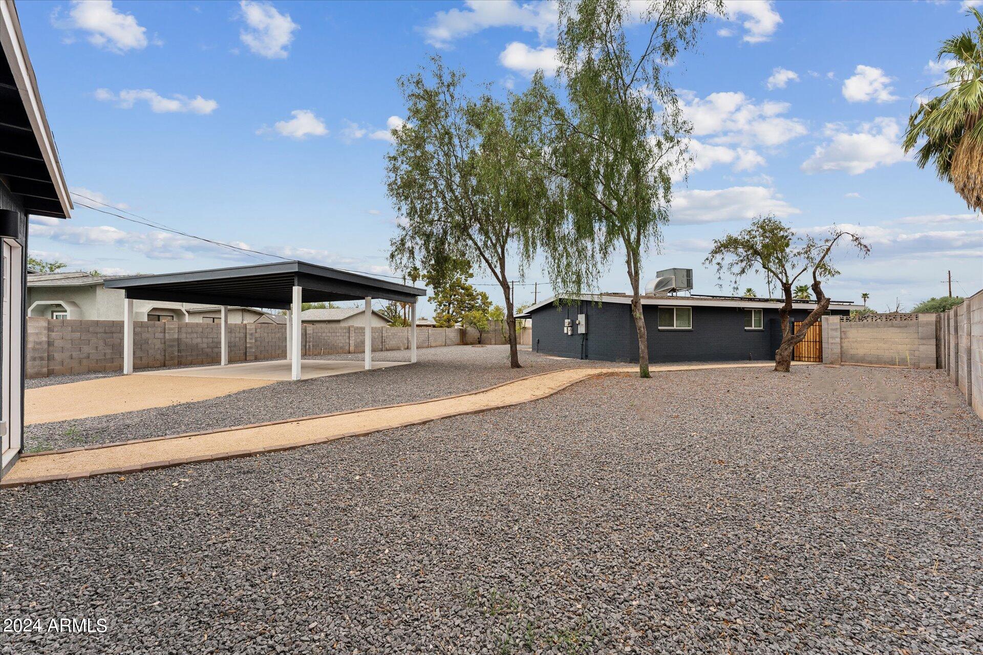 1548 North Upland Circle, Unit C Mesa, AZ 85201 - Photo 19 of 21 a view of house with yard and entertaining space