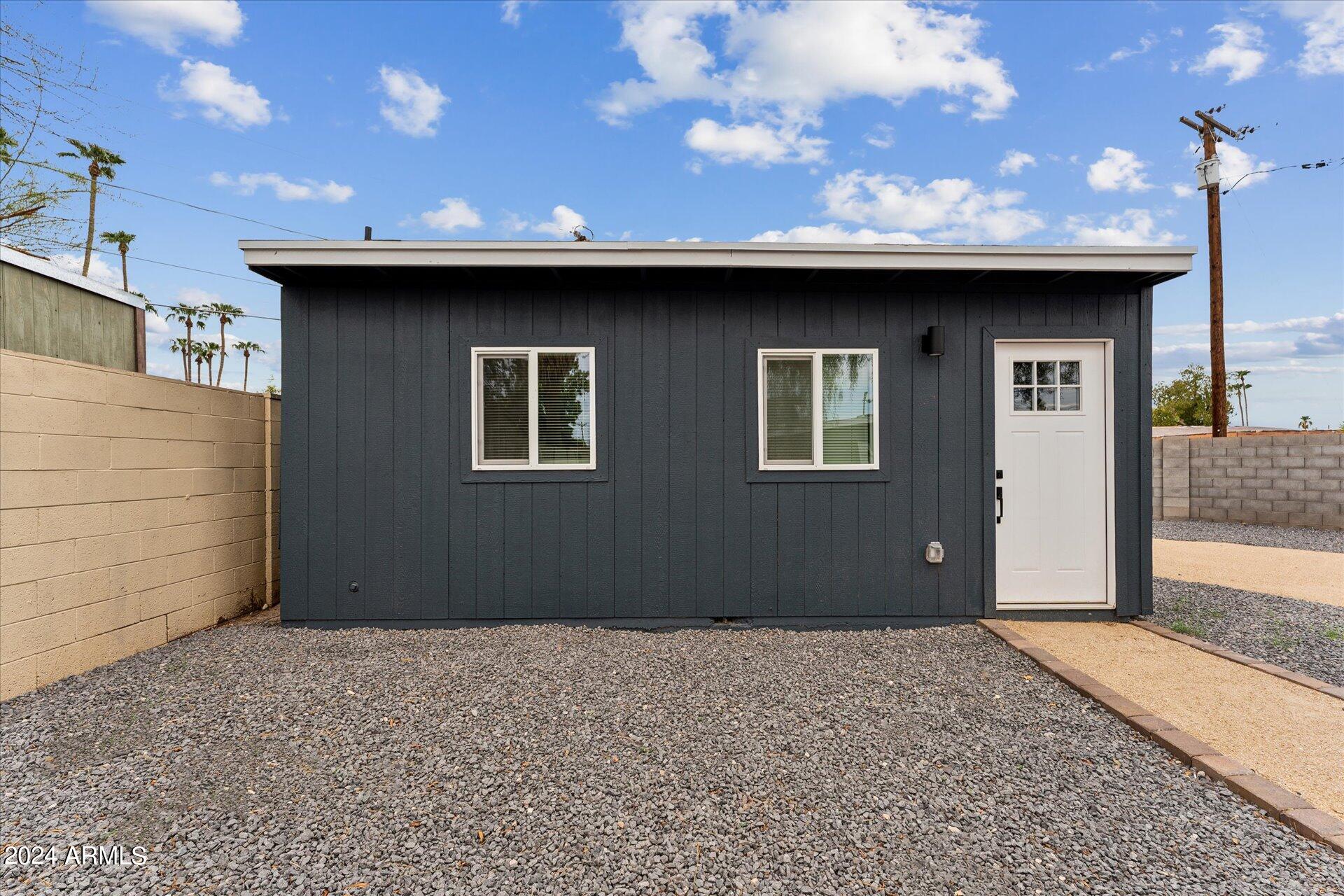 1548 North Upland Circle, Unit C Mesa, AZ 85201 - Photo 2 of 21 a view of a house with a outdoor space