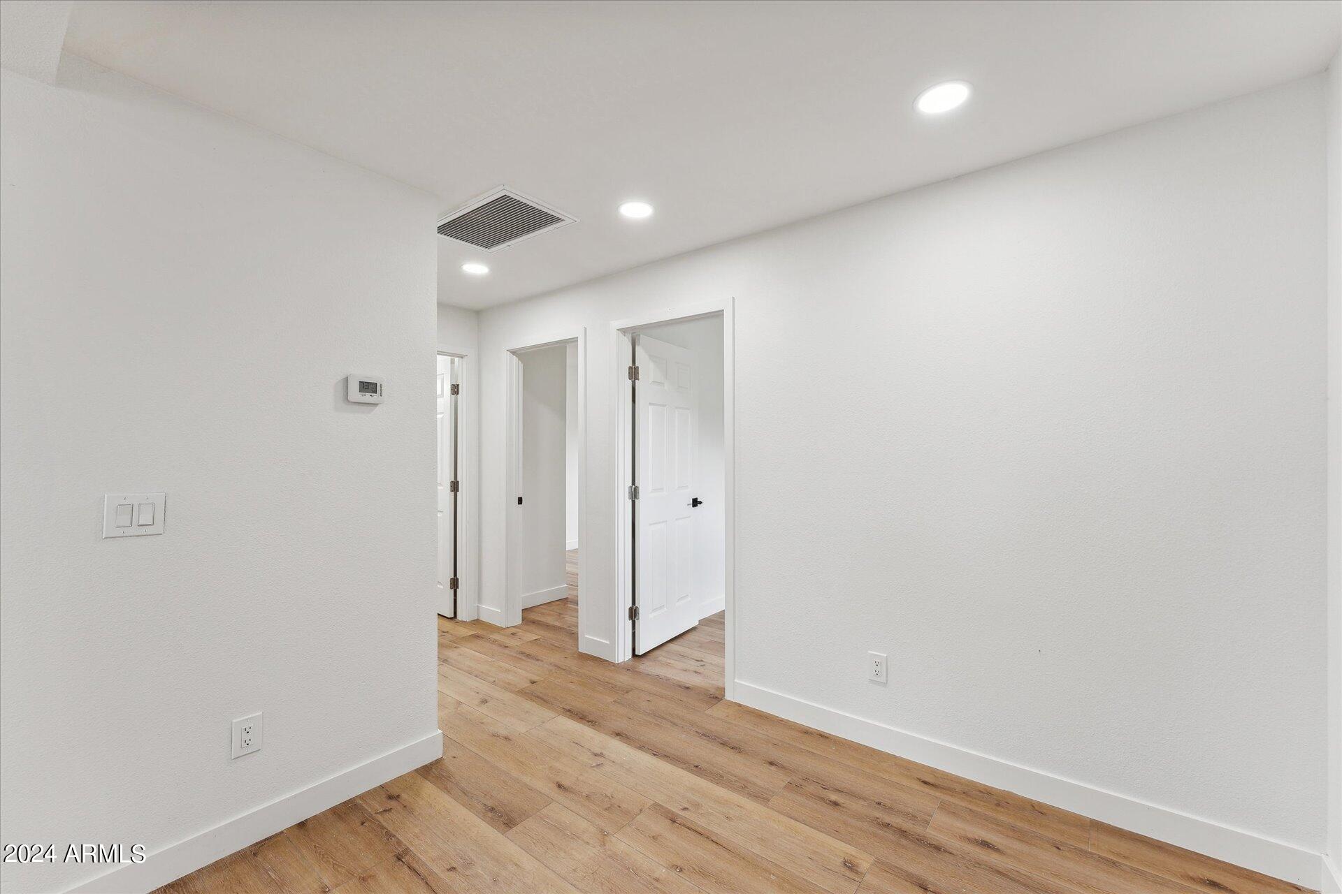 1548 North Upland Circle, Unit C Mesa, AZ 85201 - Photo 10 of 21 a view of hallway with wooden floor