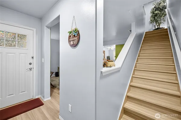 a bedroom with a bed chair and a window