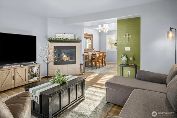 a living room with furniture and a flat screen tv