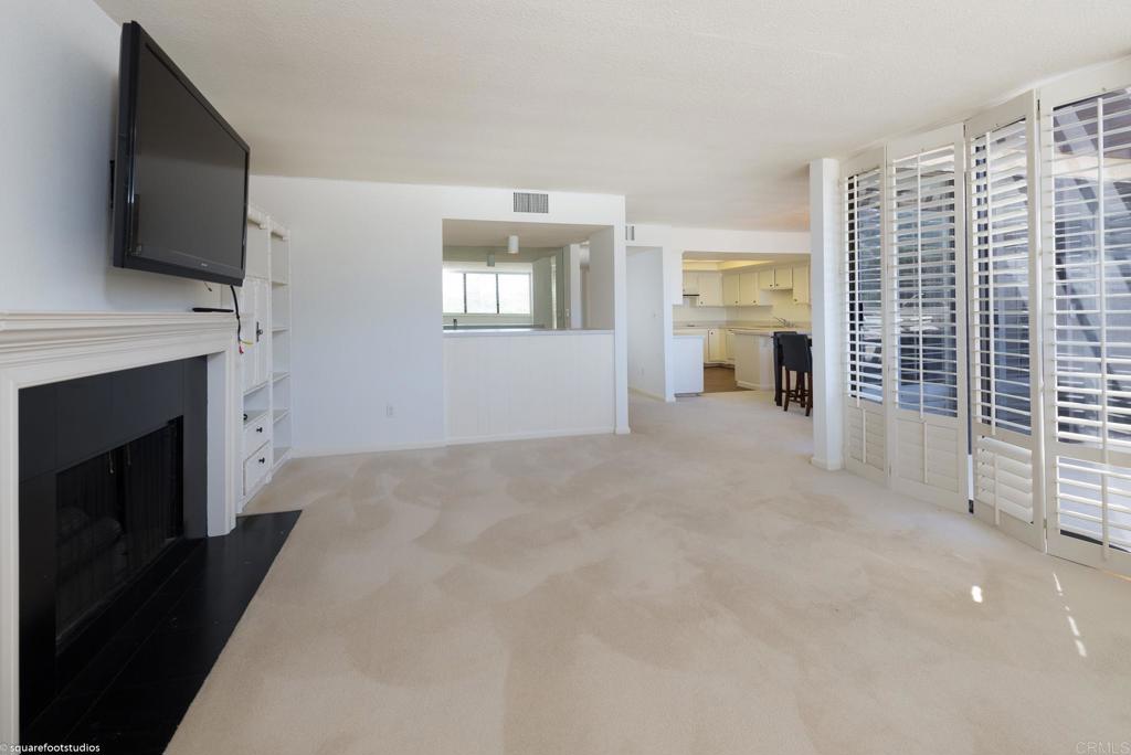 2420 Torrey Pines Road La Jolla, CA 92037 - Photo 3 of 21 a view of livingroom with furniture a fireplace and flat screen tv