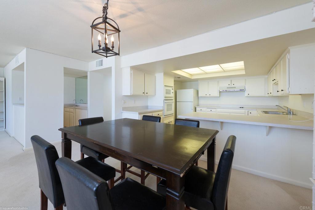 2420 Torrey Pines Road La Jolla, CA 92037 - Photo 8 of 21 a view of a dining room with furniture and wooden floor