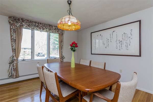 126 North Branch Road Concord, MA 01742 - Photo 5 of 22 a view of a dining room with furniture wooden floor and chandelier