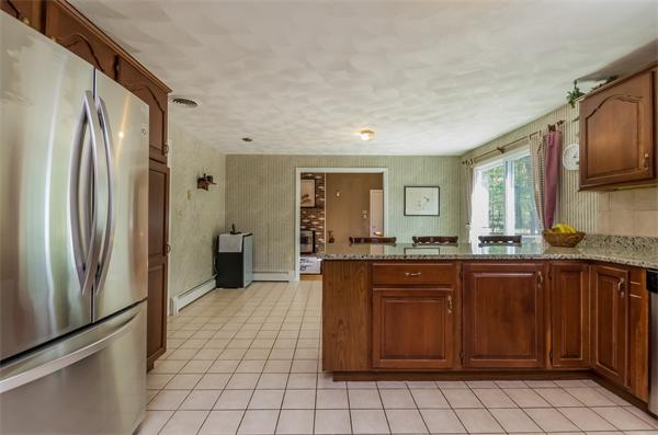 126 North Branch Road Concord, MA 01742 - Photo 8 of 22 a kitchen with stainless steel appliances granite countertop a refrigerator and a sink