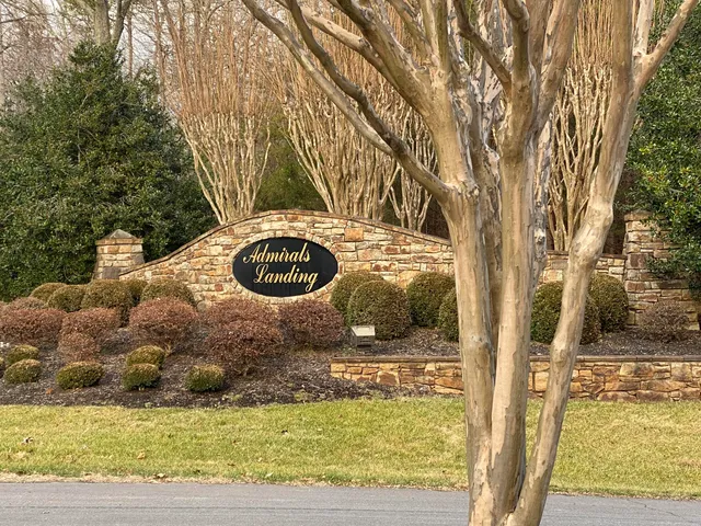 a small pool with trees in the background