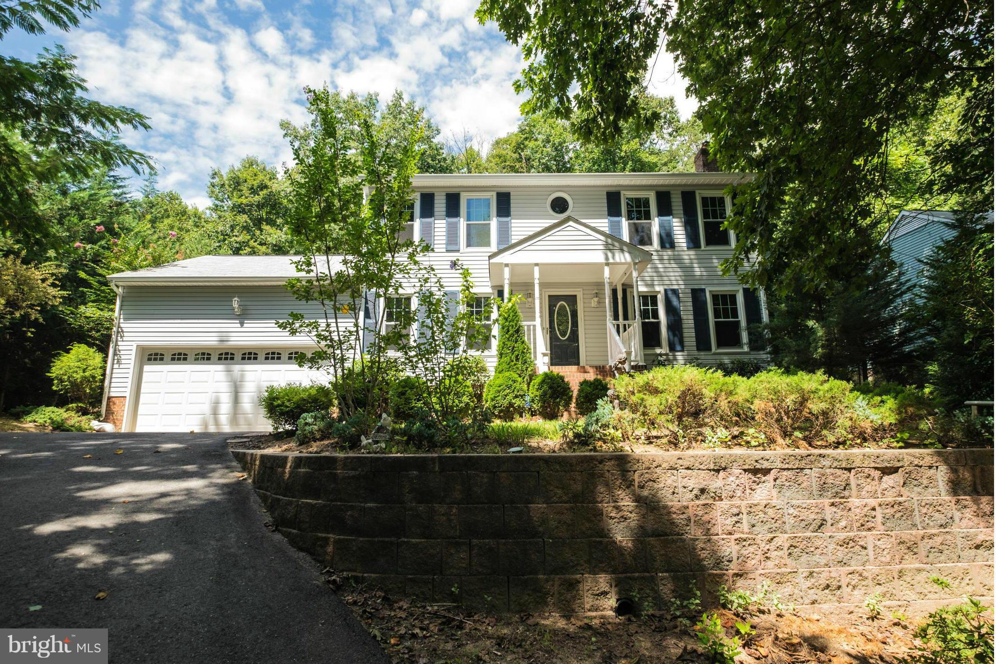 2034 Coast Guard Drive Stafford, VA 22554 - Photo 1 of 30 a front view of a house with a yard