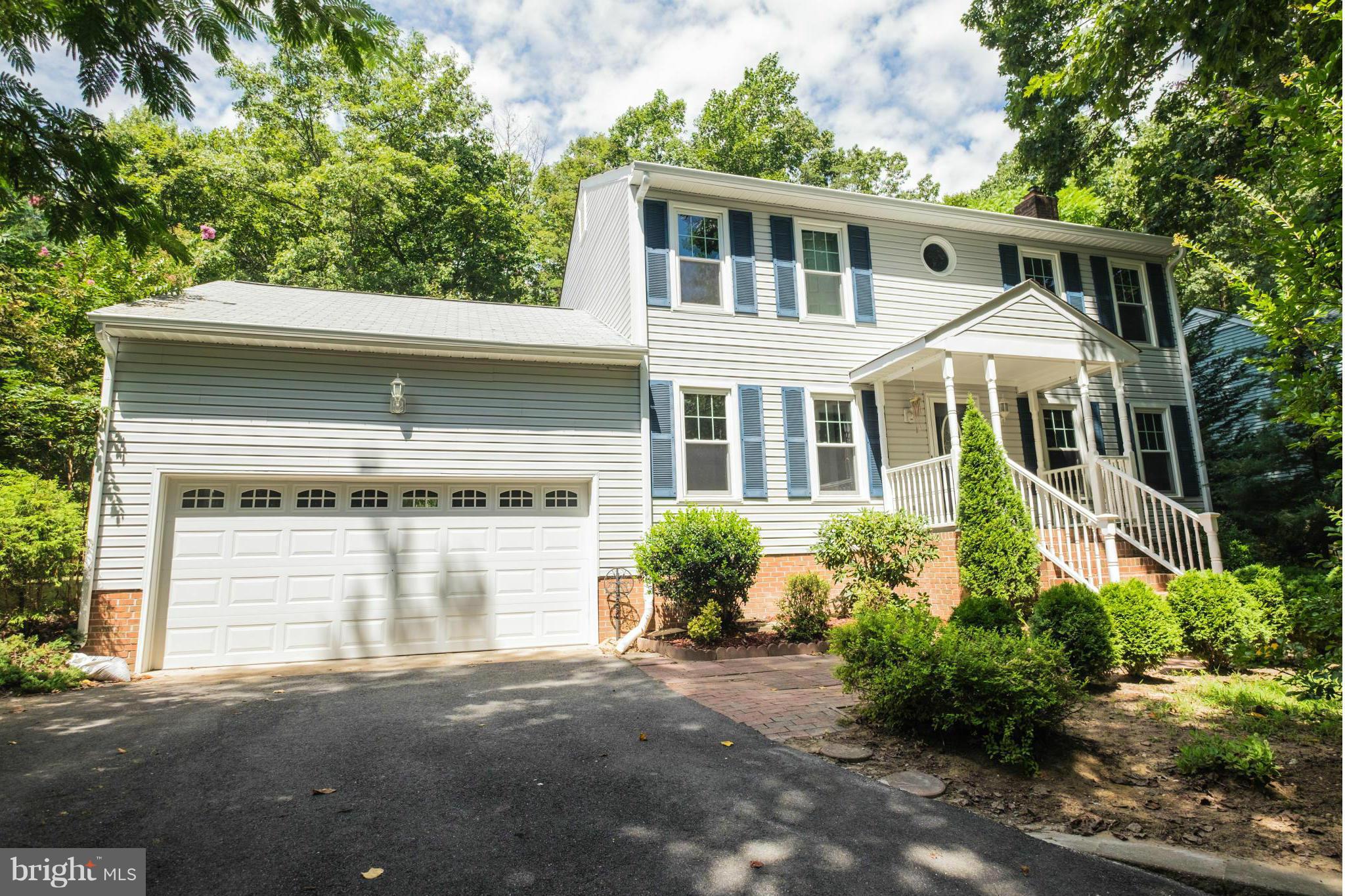 2034 Coast Guard Drive Stafford, VA 22554 - Photo 2 of 30 a front view of a house with a yard and garage