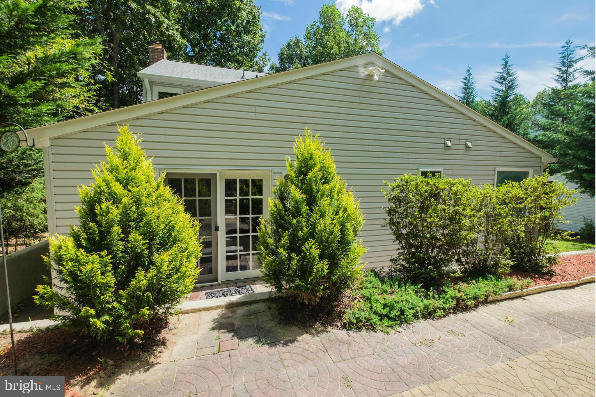 2034 Coast Guard Drive Stafford, VA 22554 - Photo 26 of 30 a front view of a house with a garden