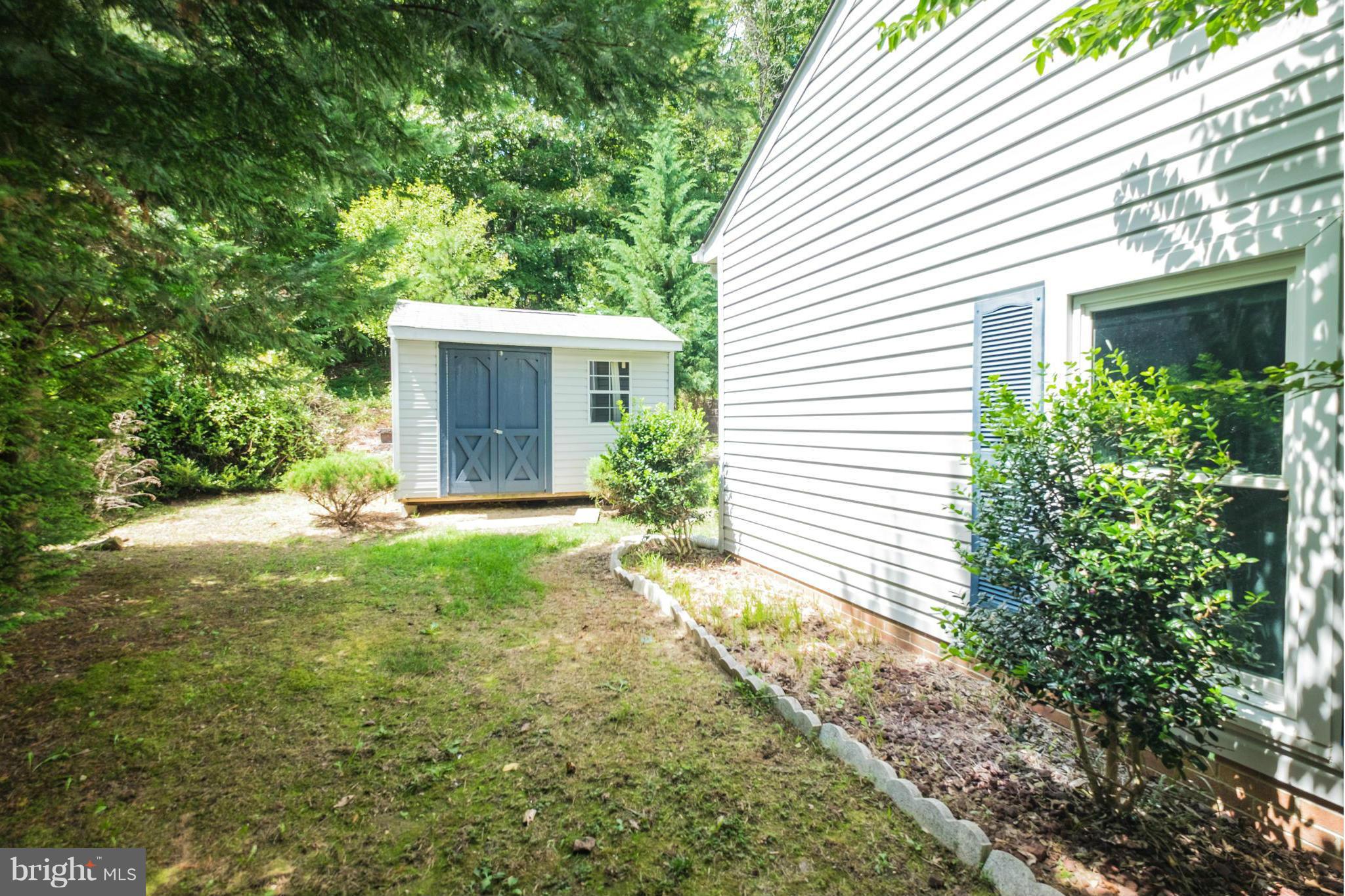 2034 Coast Guard Drive Stafford, VA 22554 - Photo 27 of 30 a view of a house with yard and a garden
