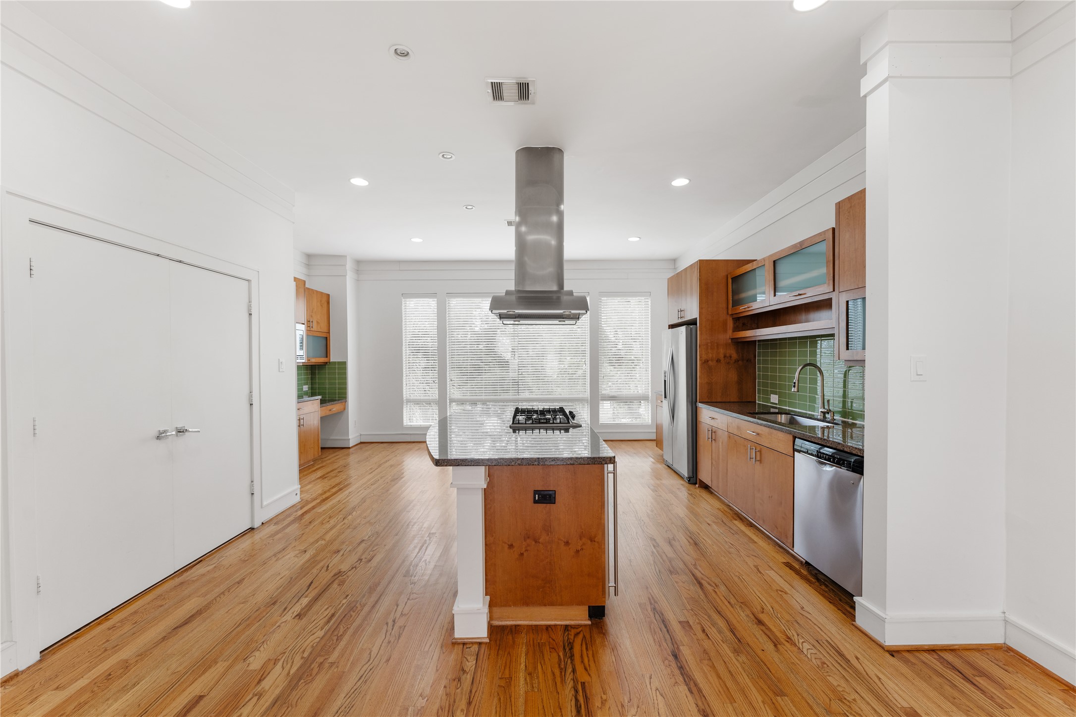 6112 Tyne Street, Unit B Houston, TX 77007 - Photo 18 of 33 a kitchen with stainless steel appliances granite countertop a refrigerator and a stove top oven