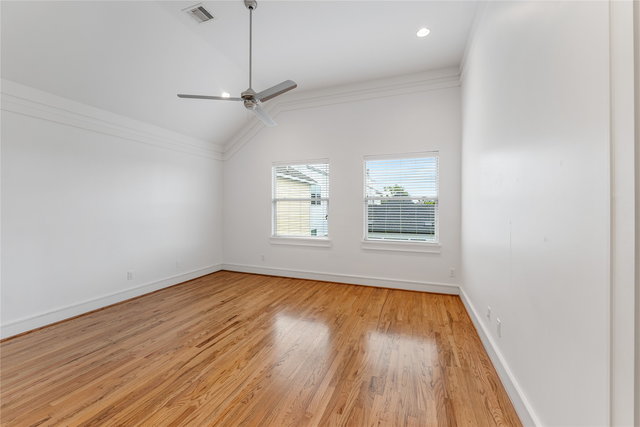 6112 Tyne Street, Unit B Houston, TX 77007 - Photo 24 of 33 wooden floor in an empty room with a window