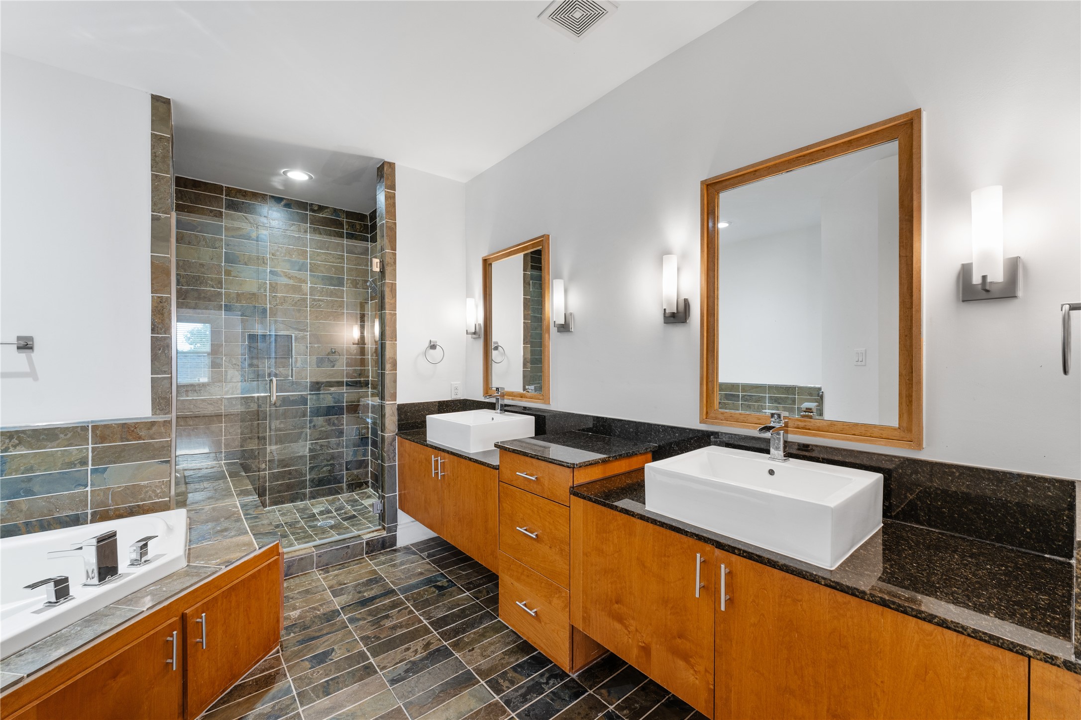 6112 Tyne Street, Unit B Houston, TX 77007 - Photo 26 of 33 a bathroom with a granite countertop sink and a mirror