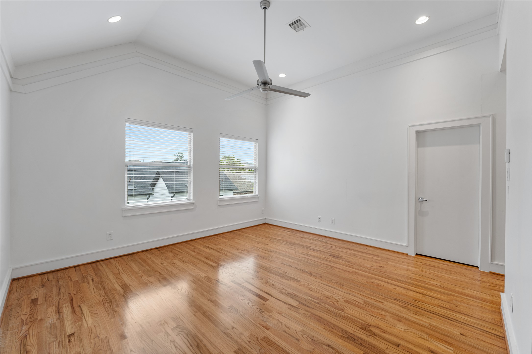 6112 Tyne Street, Unit B Houston, TX 77007 - Photo 28 of 33 wooden floor in an empty room with a window