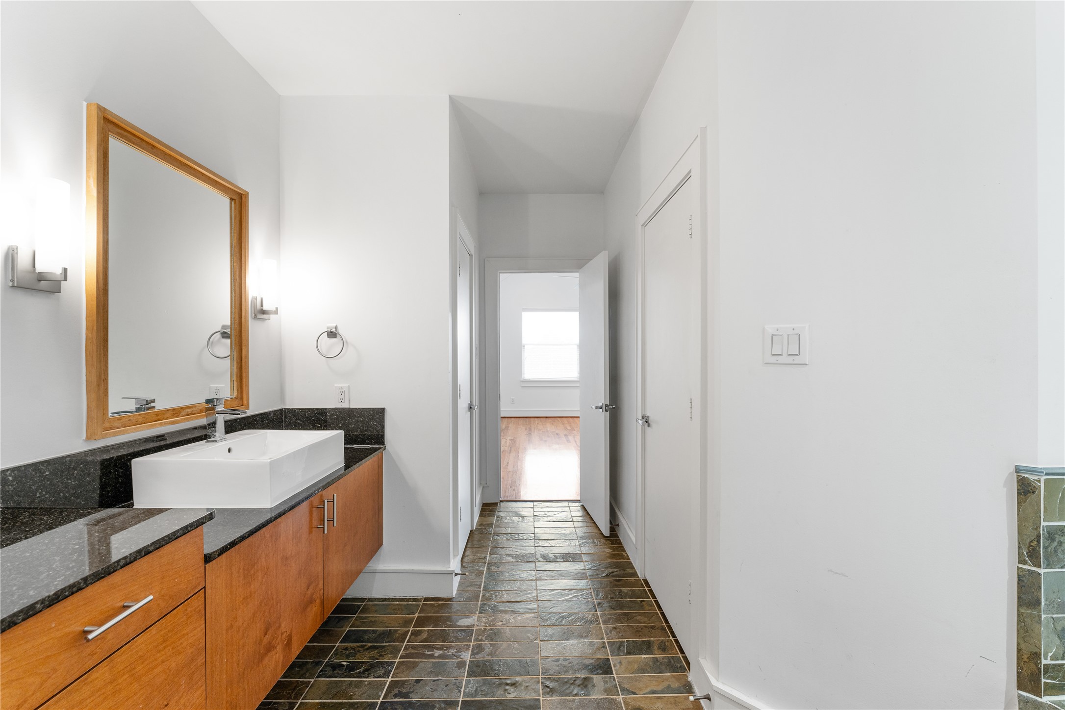6112 Tyne Street, Unit B Houston, TX 77007 - Photo 29 of 33 a large hall with sink and mirror