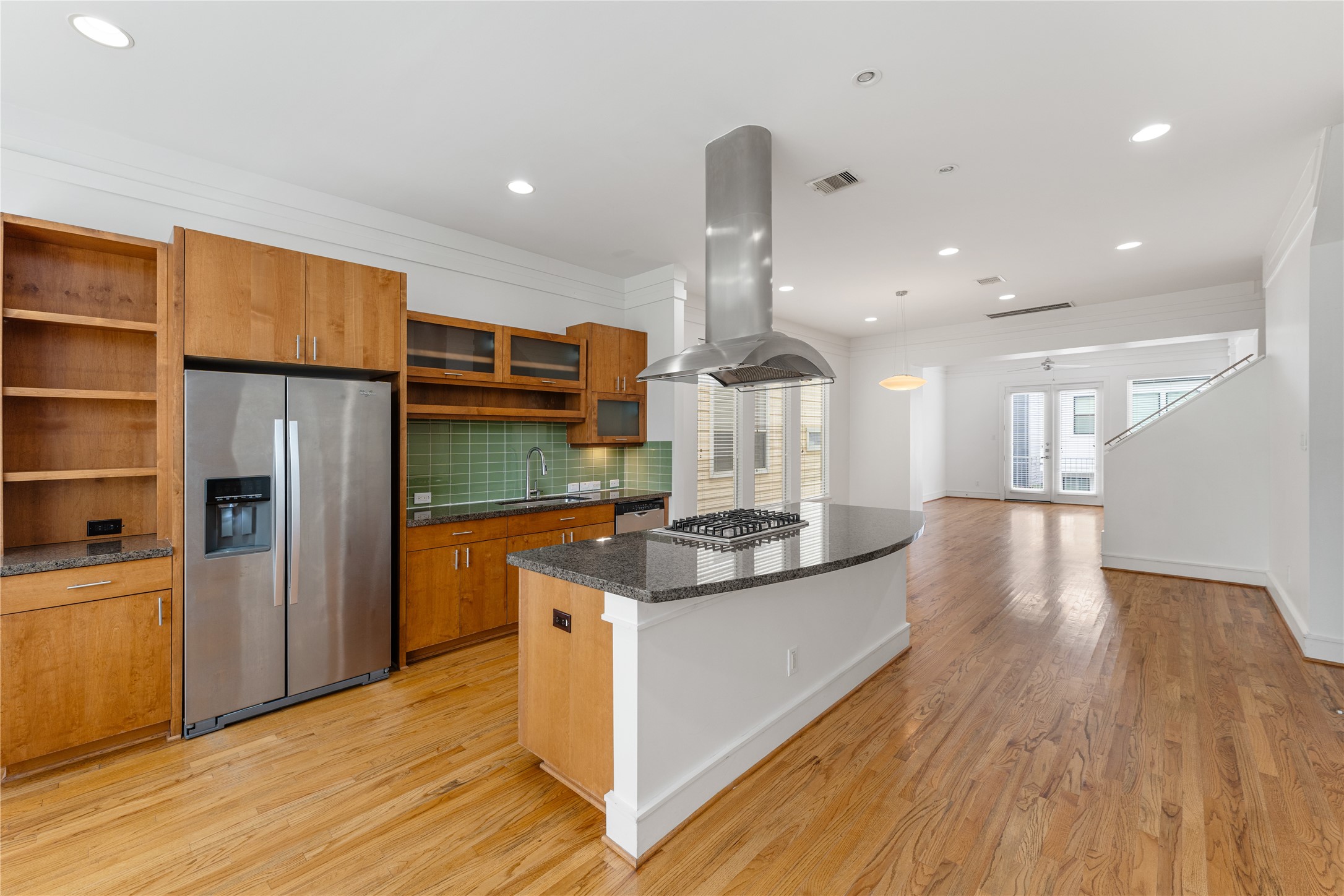 6112 Tyne Street, Unit B Houston, TX 77007 - Photo 4 of 33 a kitchen with stainless steel appliances granite countertop a sink a stove and a wooden floors