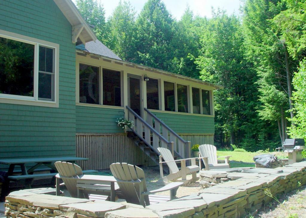 18 Bama Road Lakeville, ME 04487 - Photo 6 of 35 Lake front patio area with stone...