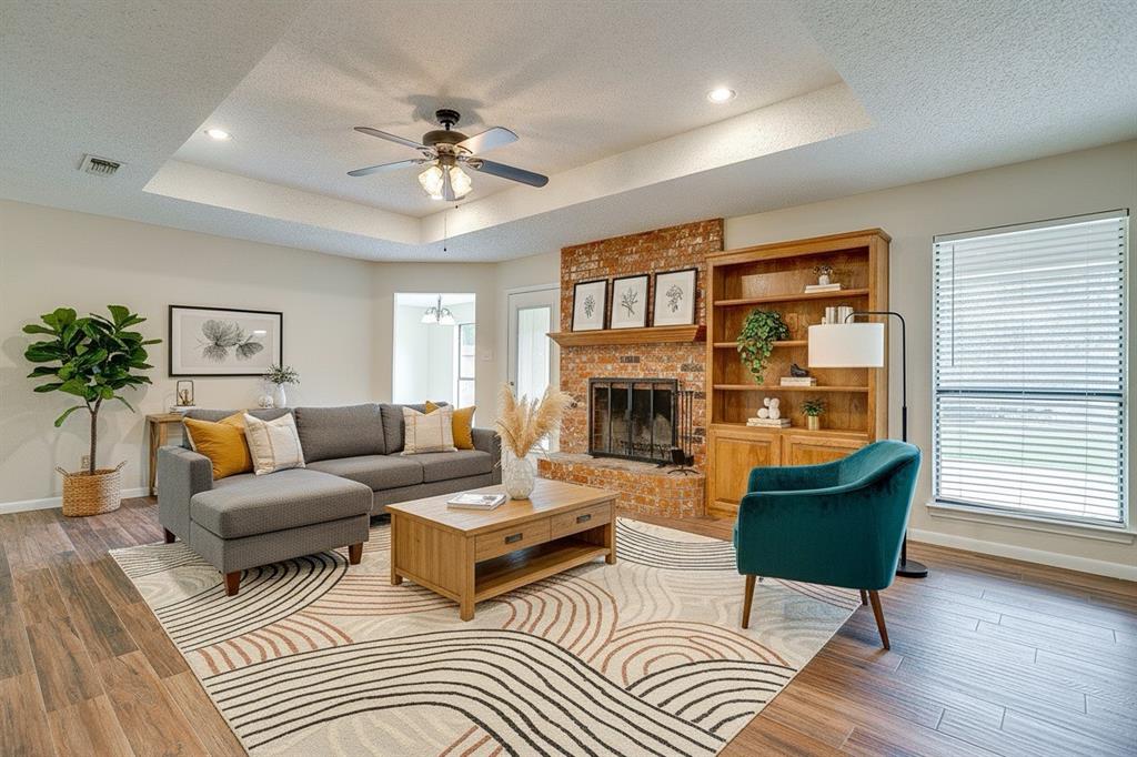 8613 Silver Creek Road White Settlement, TX 76108 - Photo 5 of 40 a living room with furniture and a fireplace