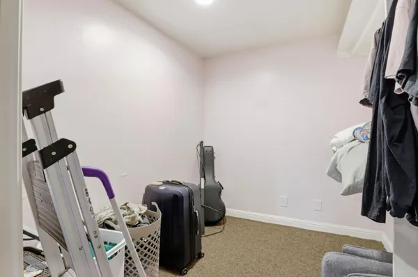 an aerial view of a house with a yard and garden