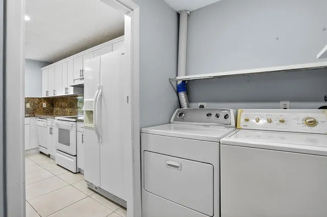 a utility room with dryer and washer