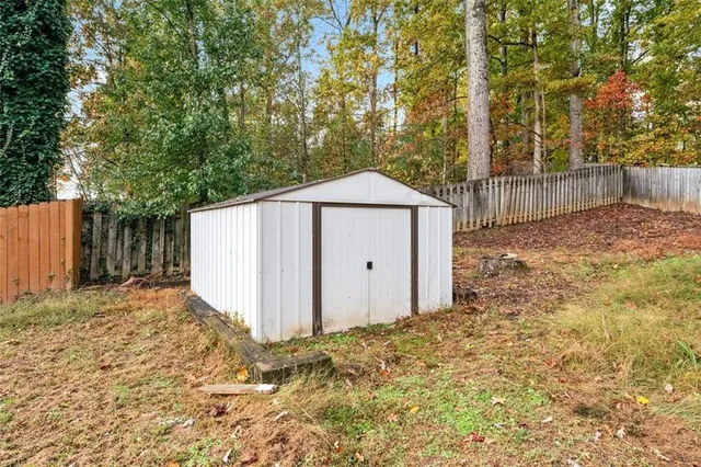 a view of a house with a snow in the yard