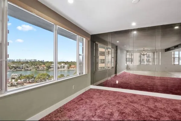 a view of an empty room with a large window