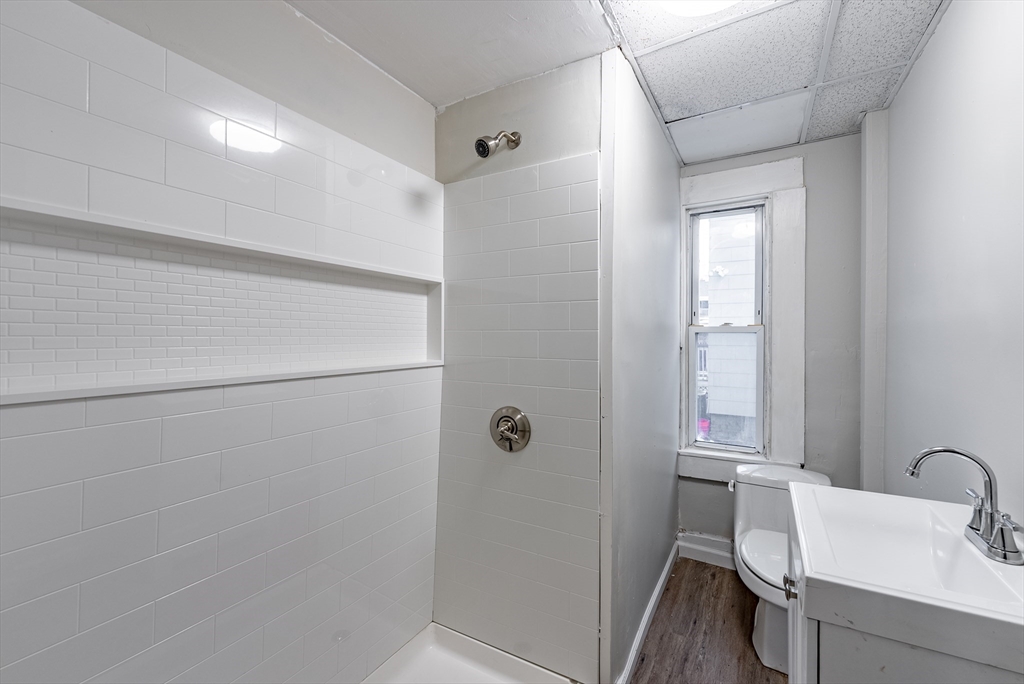 84-86 Bowles Street Springfield, MA 01109 - Photo 14 of 21 a bathroom with a sink and mirror