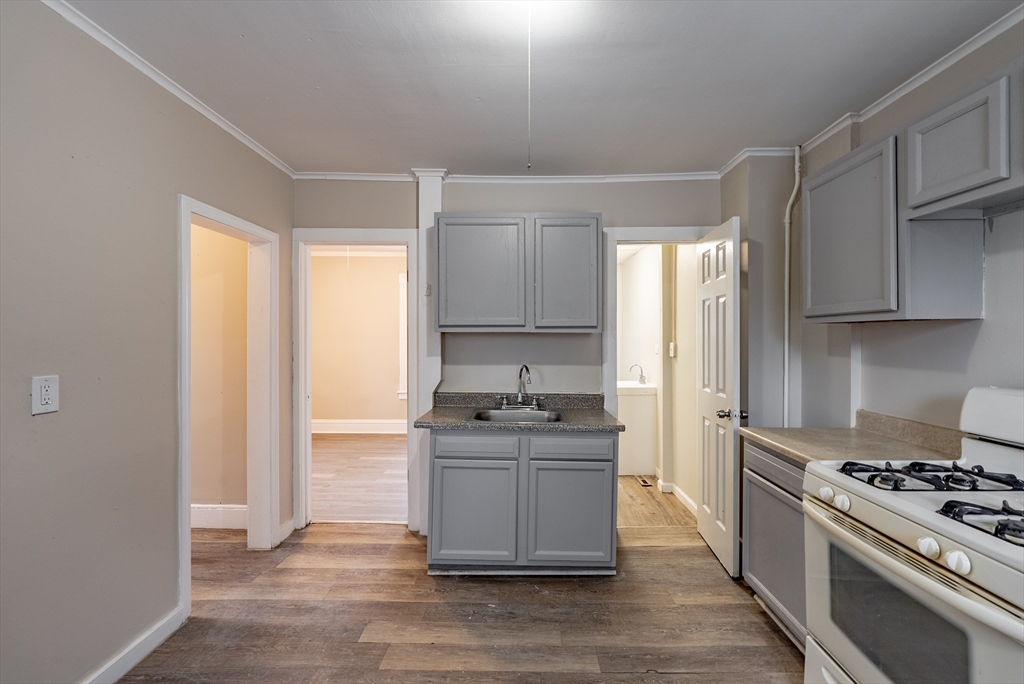 84-86 Bowles Street Springfield, MA 01109 - Photo 5 of 21 a kitchen with stainless steel appliances granite countertop a stove and a refrigerator