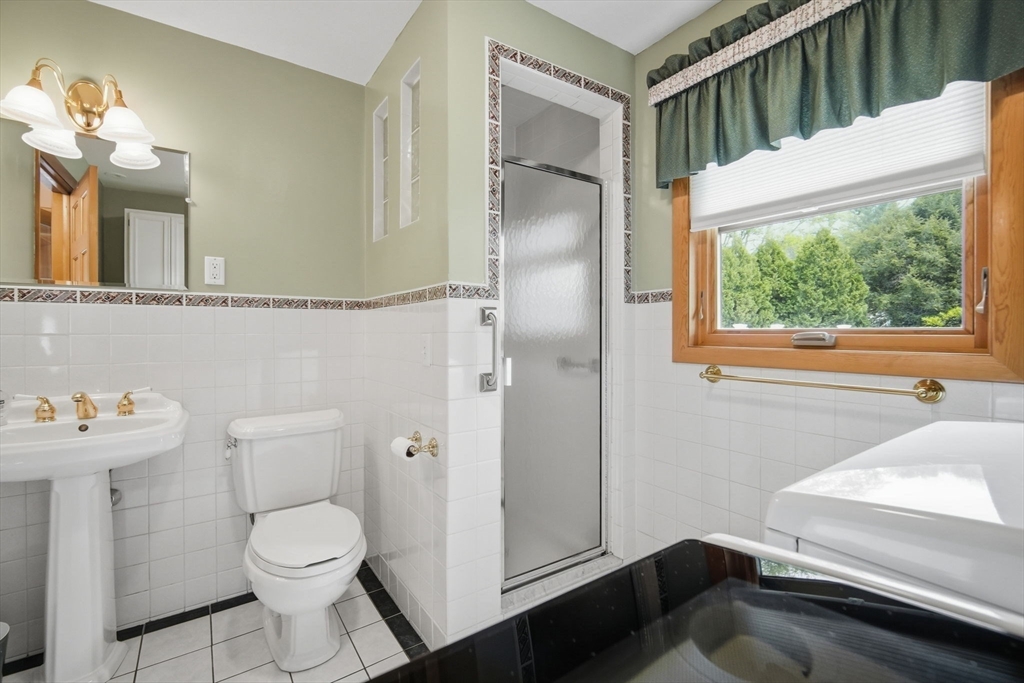 30 Birch Hill Road Northampton, MA 01062 - Photo 36 of 42 a bathroom with a toilet a sink and a mirror