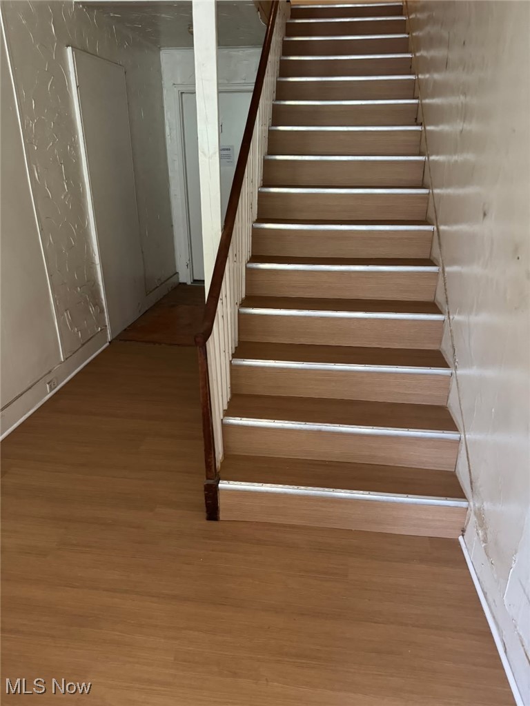 5466 South Ridge Road Madison, OH 44057 - Photo 4 of 17 Stairway featuring new LVT flooring