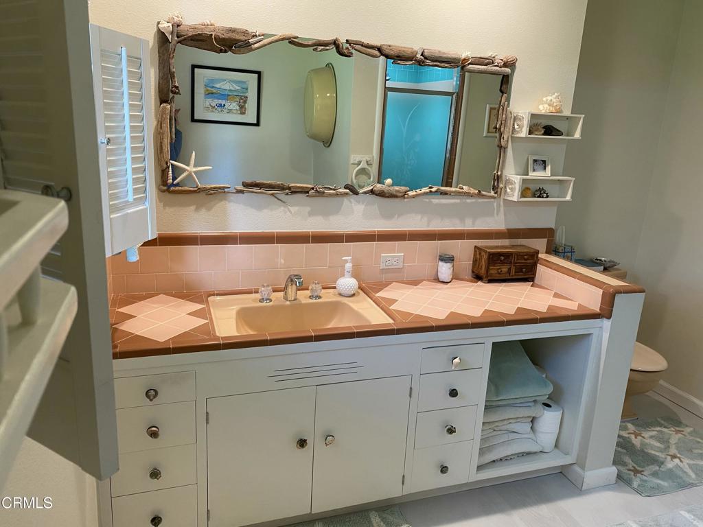 31400 Sherwood Road Fort Bragg, CA 95437 - Photo 32 of 55 a bathroom with a sink and a mirror